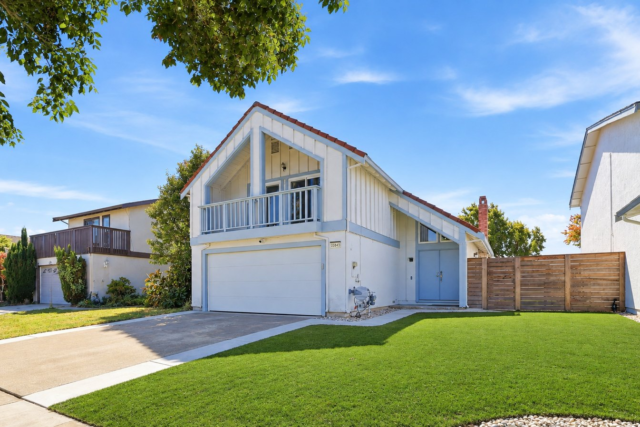 Front exterior of 35845 Tozier St, a two-story home in Newark with a tile roof, upstairs balcony and new front lawn