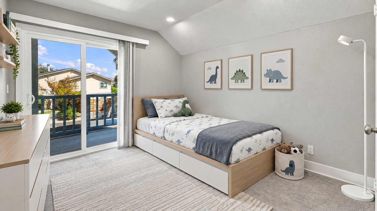 Second upstairs bedroom with vaulted ceiling and sliding door to its own private balcony